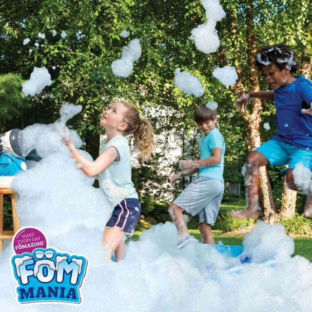 Three young kids playing in the yard with foam