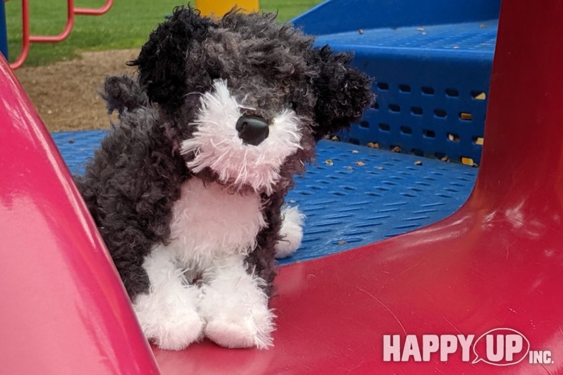 Douglas Plush Puppy tries the slide