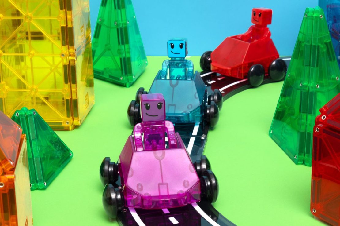 Magna-Tiles In Motion sets feature racing cars and roadways!